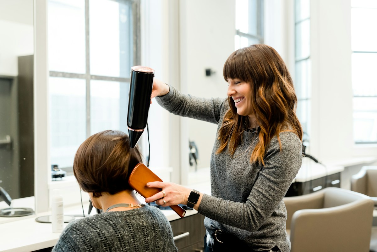 A stylist caring for a customer's hair